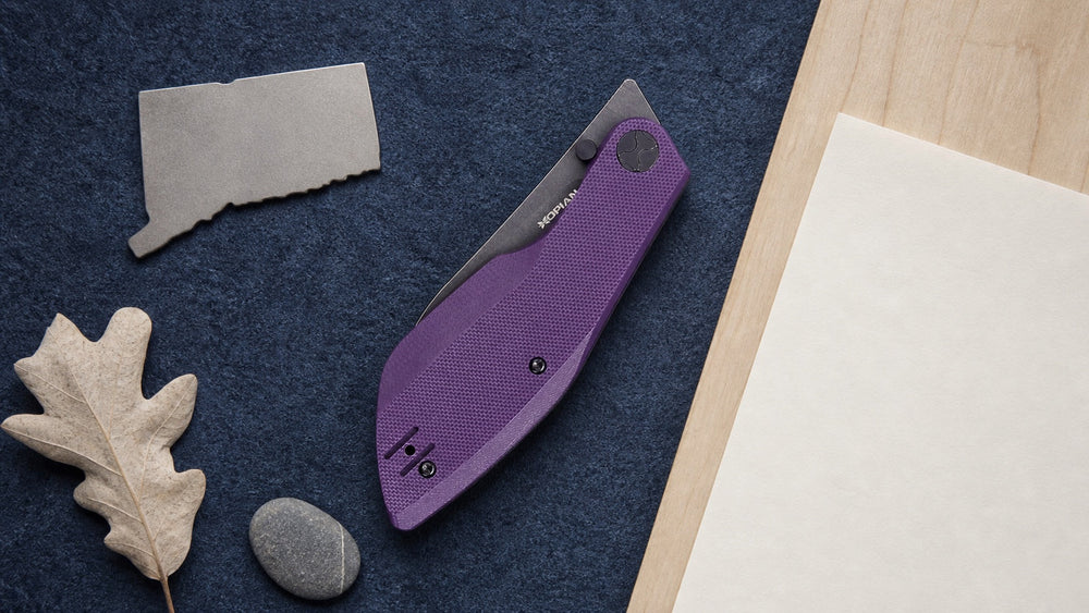 Closed purple HOPIAN Periodic knife in a neutral Connecticut legal research scene