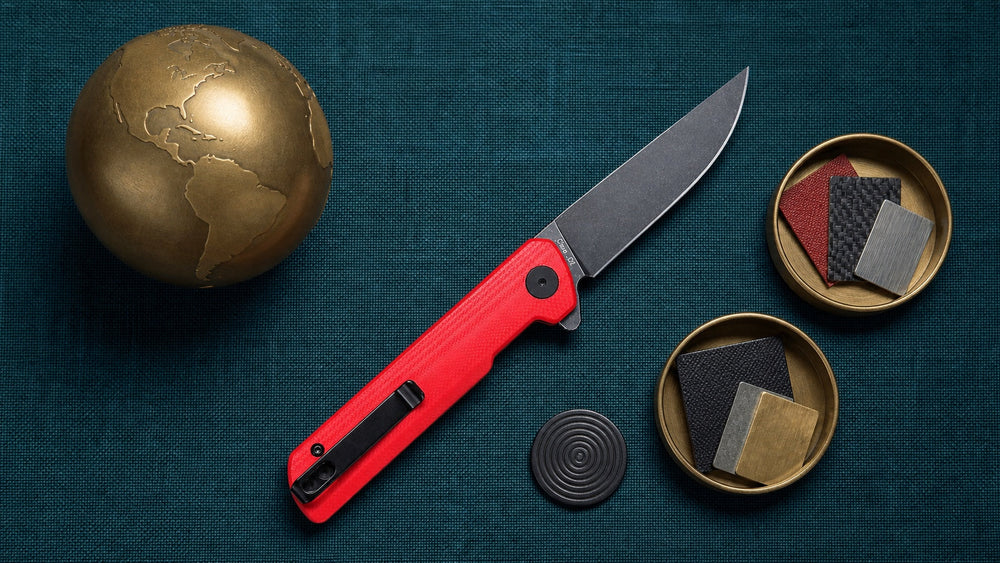 Red HOPIAN Clave folding knife in an overhead global quality control scene