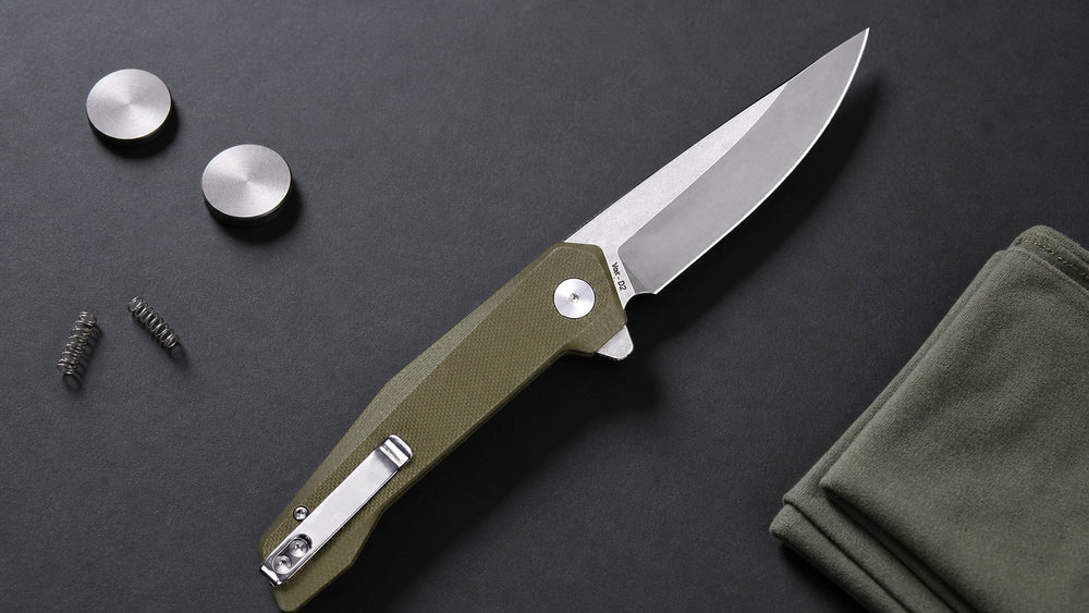 Green HOPIAN VEX folding knife on an overhead lock maintenance study table
