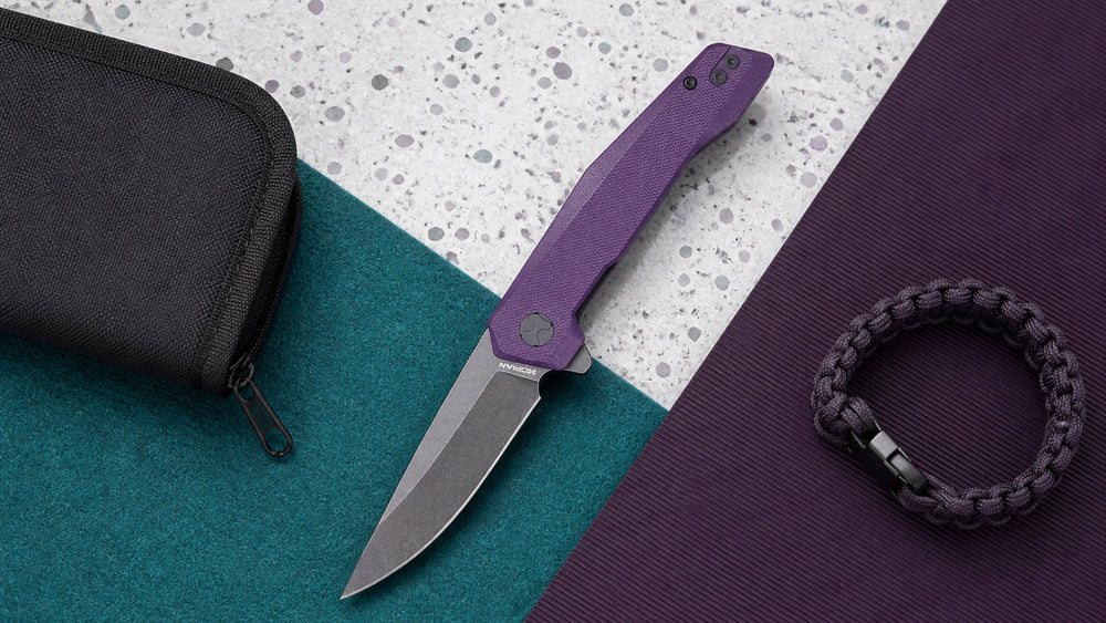 Open purple HOPIAN Vex knife with a pouch and braided bracelet