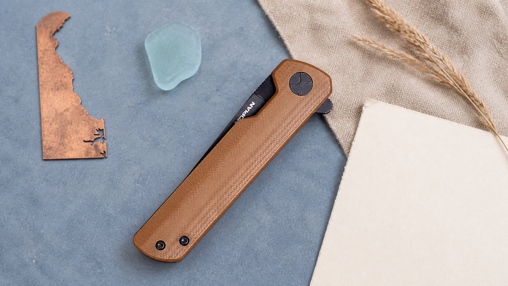 Closed brown HOPIAN Clave knife in a neutral Delaware legal research scene