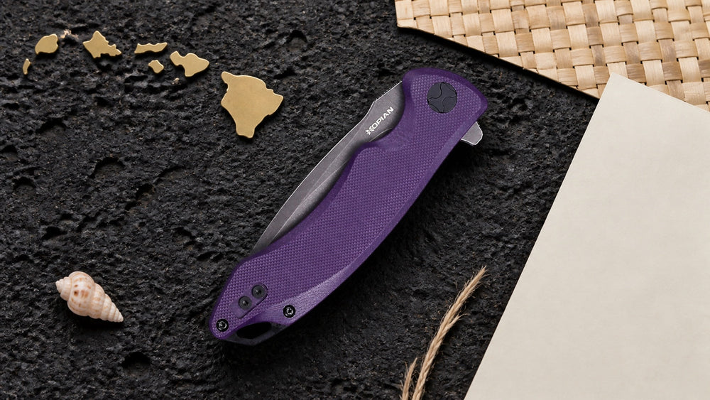 Closed purple HOPIAN Arcus knife in a neutral Hawaii legal research scene