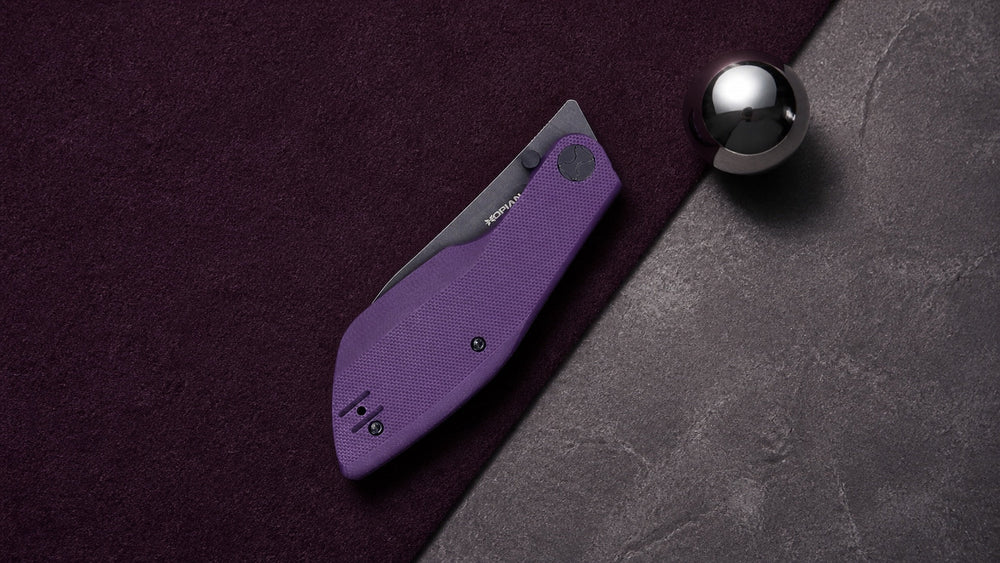 Geschlossenes violettes HOPIAN Periodic Messer mit einer polierten Kugel, die auf eine Rasthaltung hindeutet