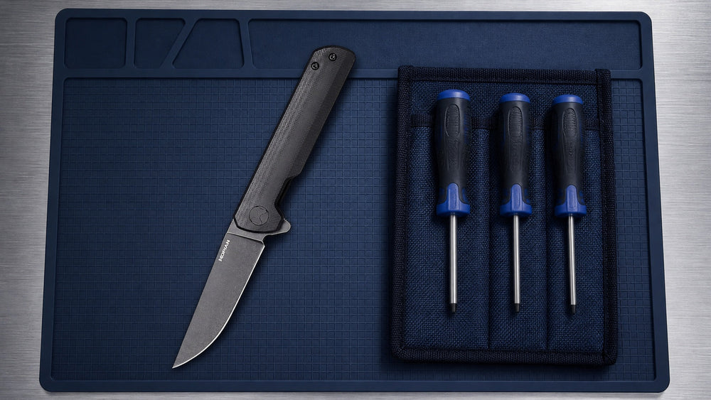 Open black HOPIAN Clave knife with complete Torx screwdrivers on a service mat