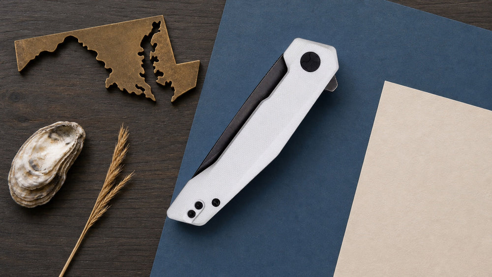 Closed white HOPIAN Vex knife in a neutral Maryland legal research scene