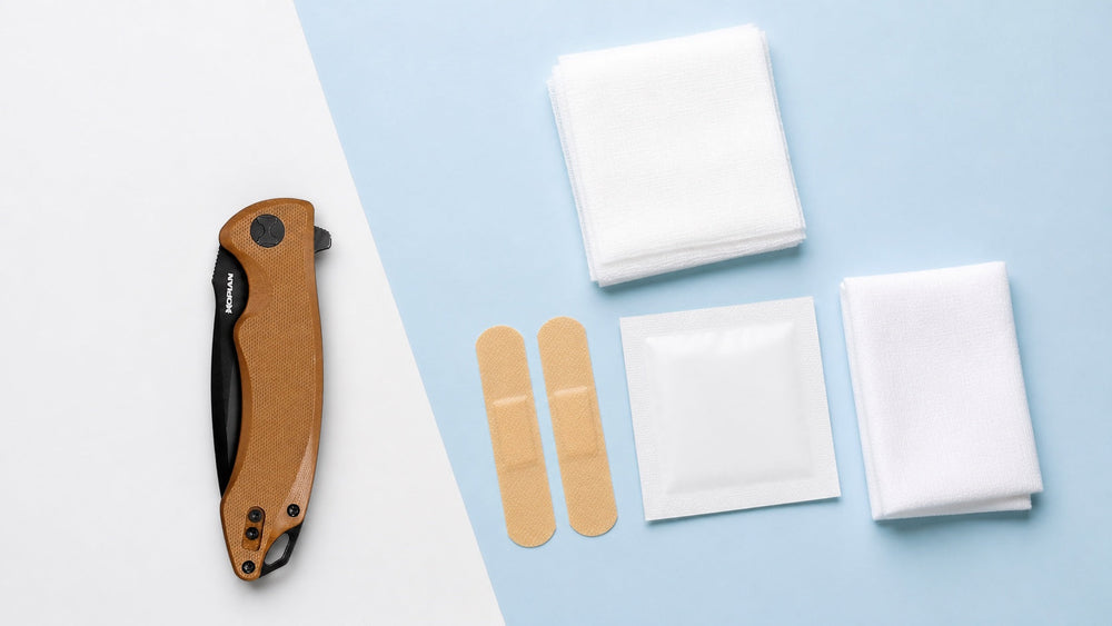 Closed HOPIAN Arcus folding knife beside clean first-aid supplies on a pale blue table