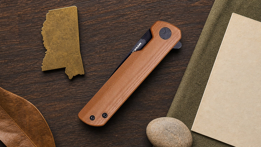 Closed brown HOPIAN Clave knife in a neutral Mississippi legal research scene
