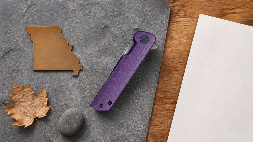 Closed purple HOPIAN Clave knife in a neutral Missouri legal research scene