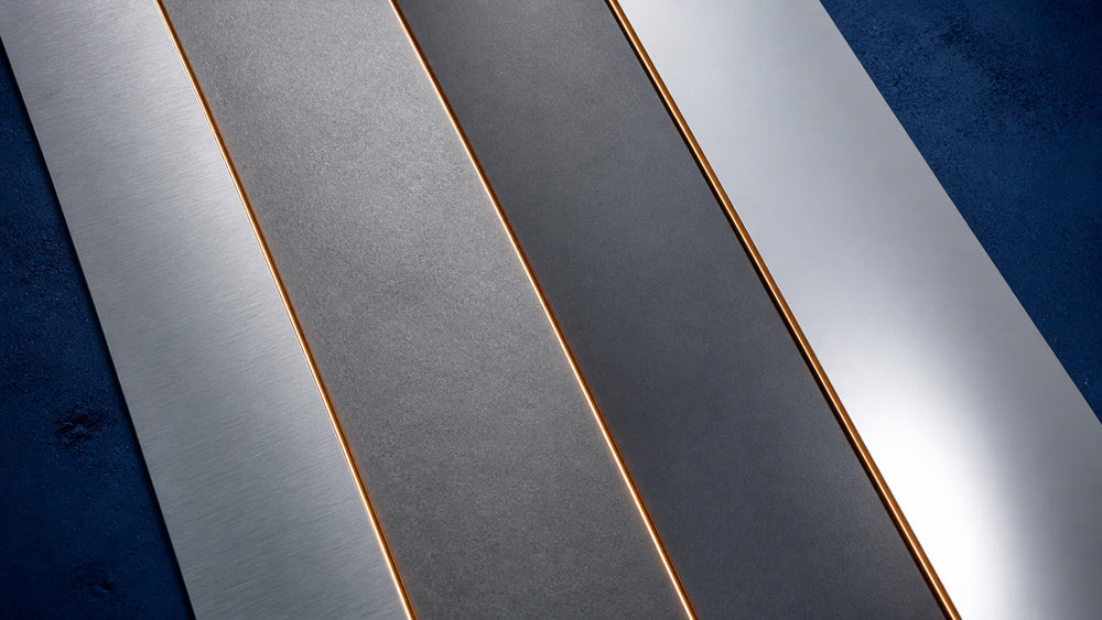 Four steel surface finishes representing N690, 154CM, D2, and S30V