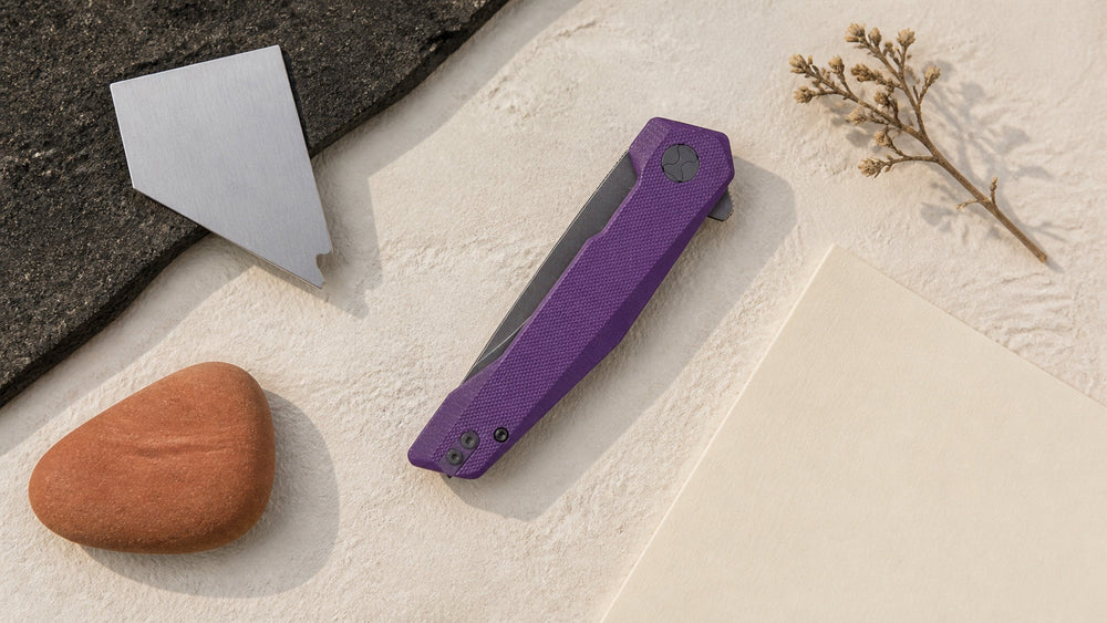 Closed purple HOPIAN Vex knife in a neutral Nevada legal research scene