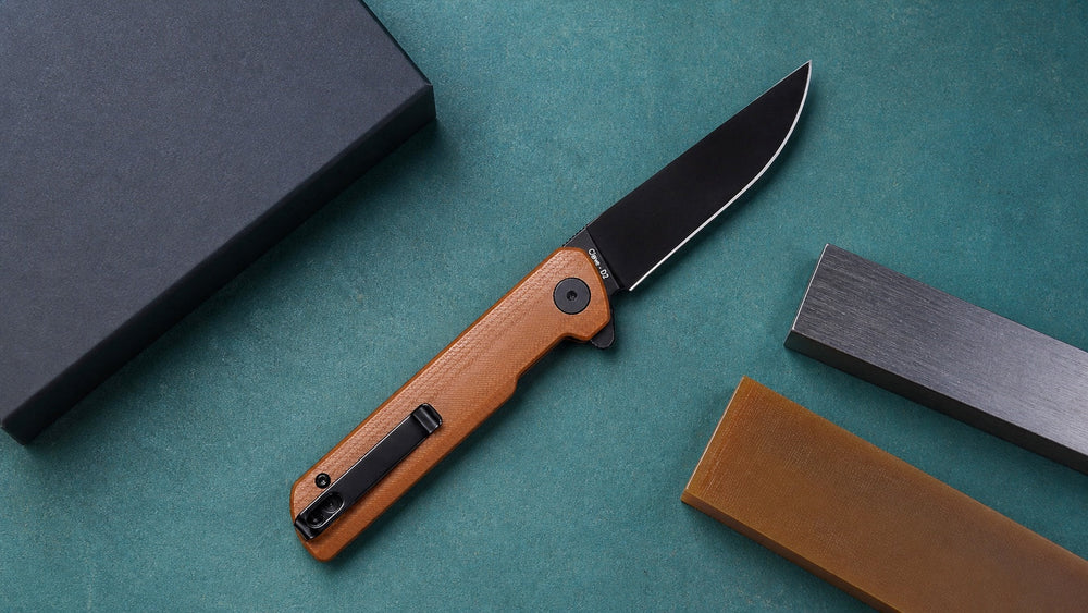 Open brown HOPIAN Clave knife with intact material samples on a production table