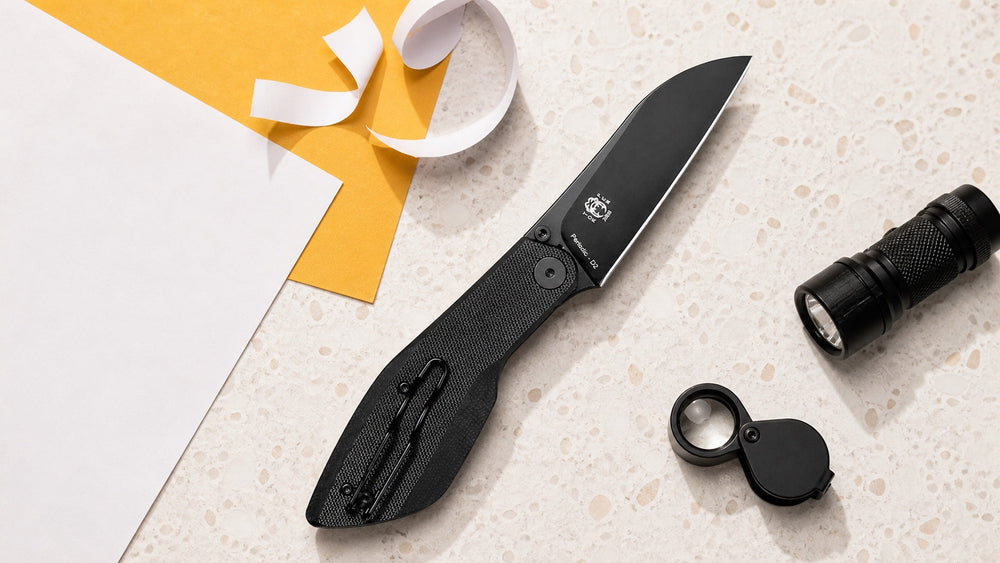 Schwarzes HOPIAN Periodic Messer mit Papier und leichten Werkzeugen für sichere Schärfeprüfung