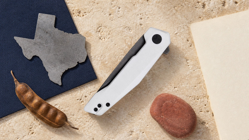 Closed white HOPIAN Vex knife in a neutral Texas legal research scene