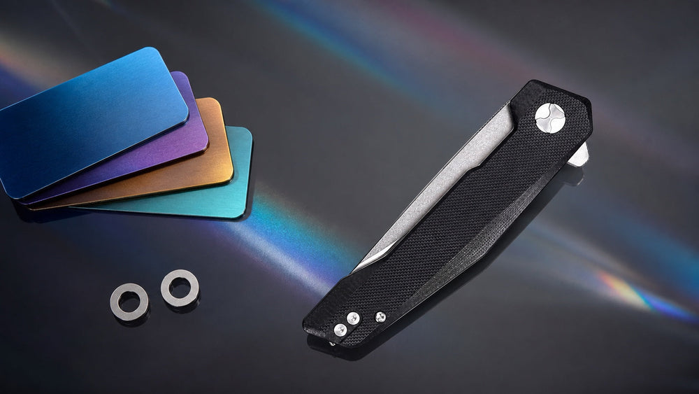 Closed black HOPIAN VEX knife beside colorful anodized titanium samples