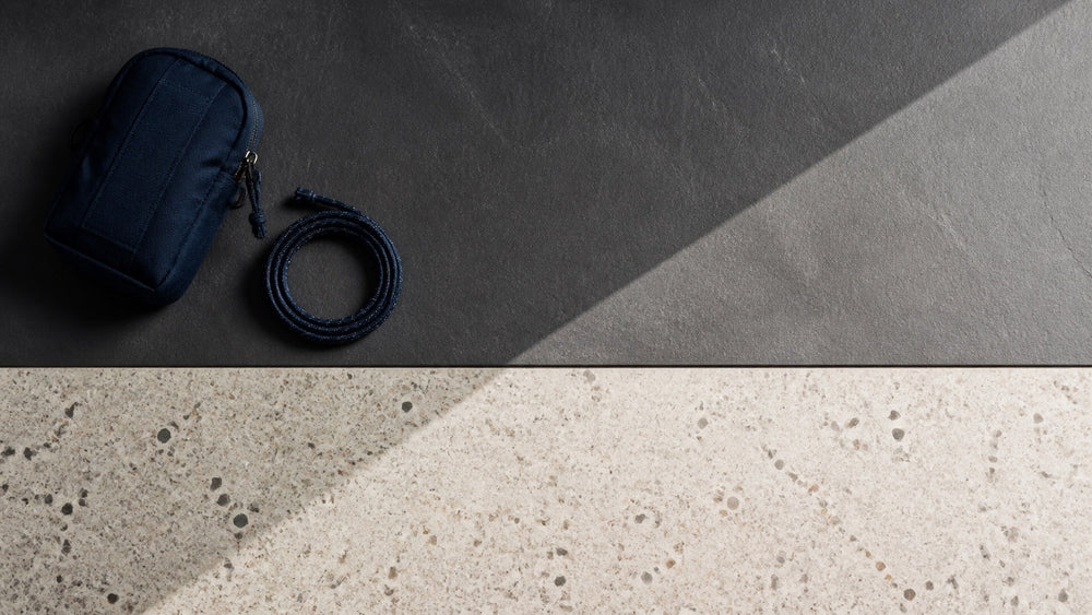 Straight-edged slate and angular shadow with a utility pouch and coiled cord